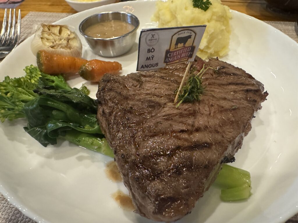 200g steak with side dishes at Johnny Steak House