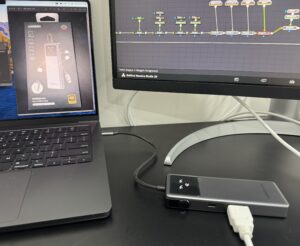 MacBook Pro connected to an external monitor via a UGREEN USB-C hub while editing in DaVinci Resolve