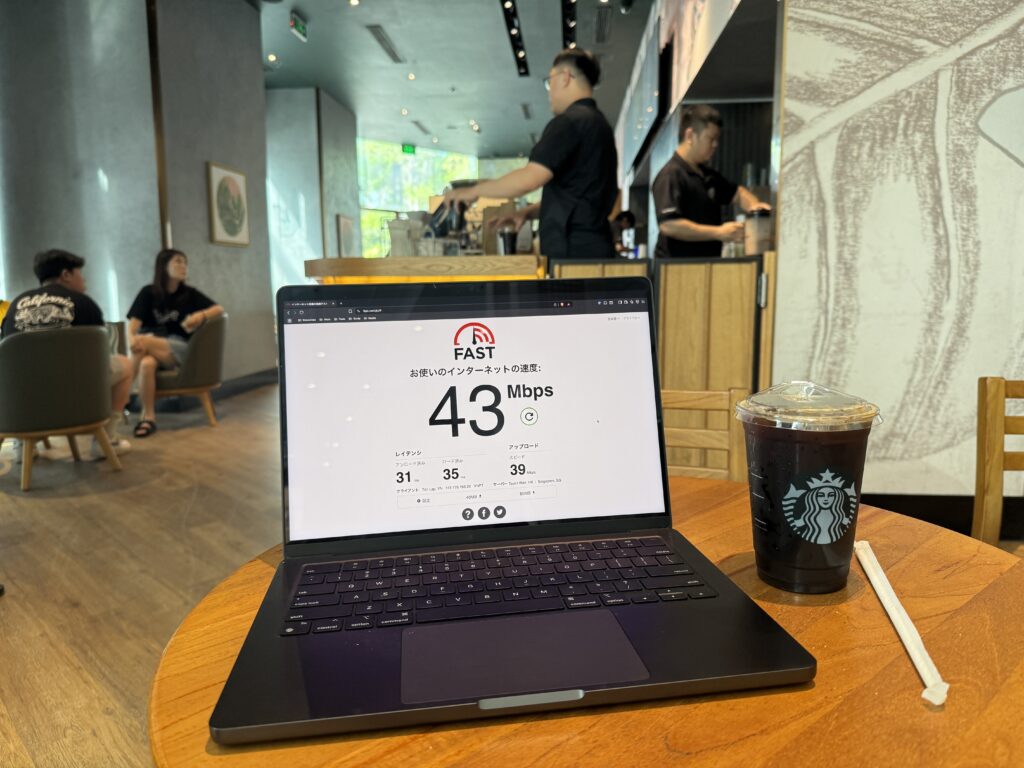 Fast.com speed test showing 43 Mbps at Starbucks Beachfront