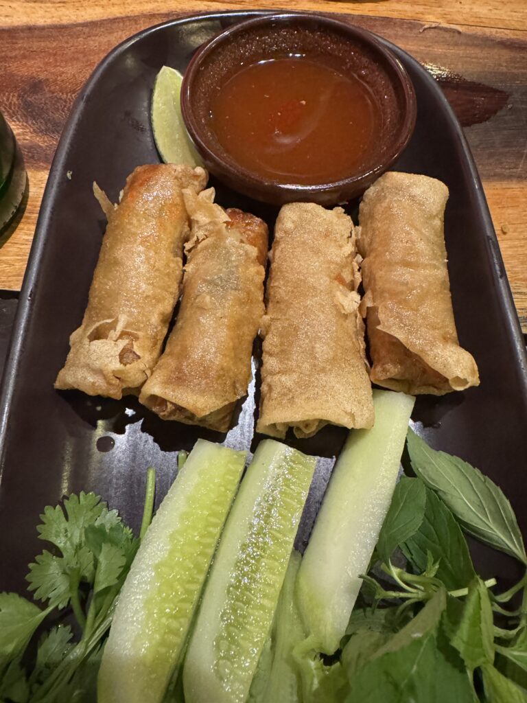 Vietnamese fried spring rolls (cha gio) with fresh herbs