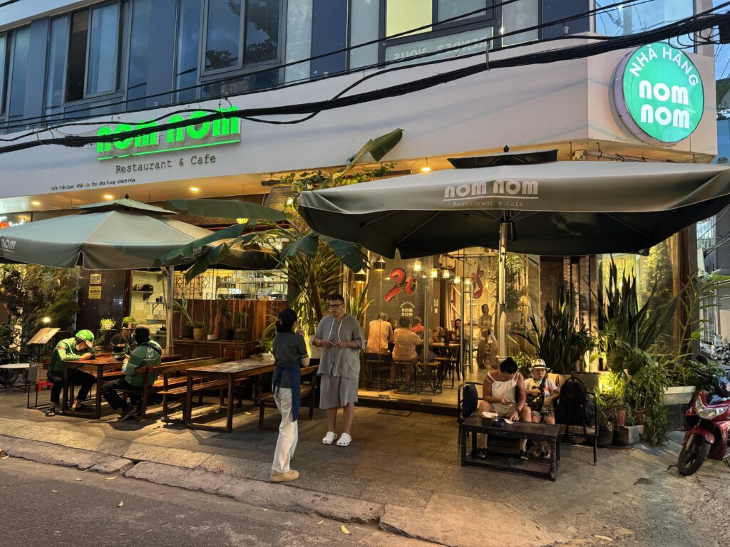 Night exterior of nom nom Restaurant & Cafe in Nha Trang, Vietnam