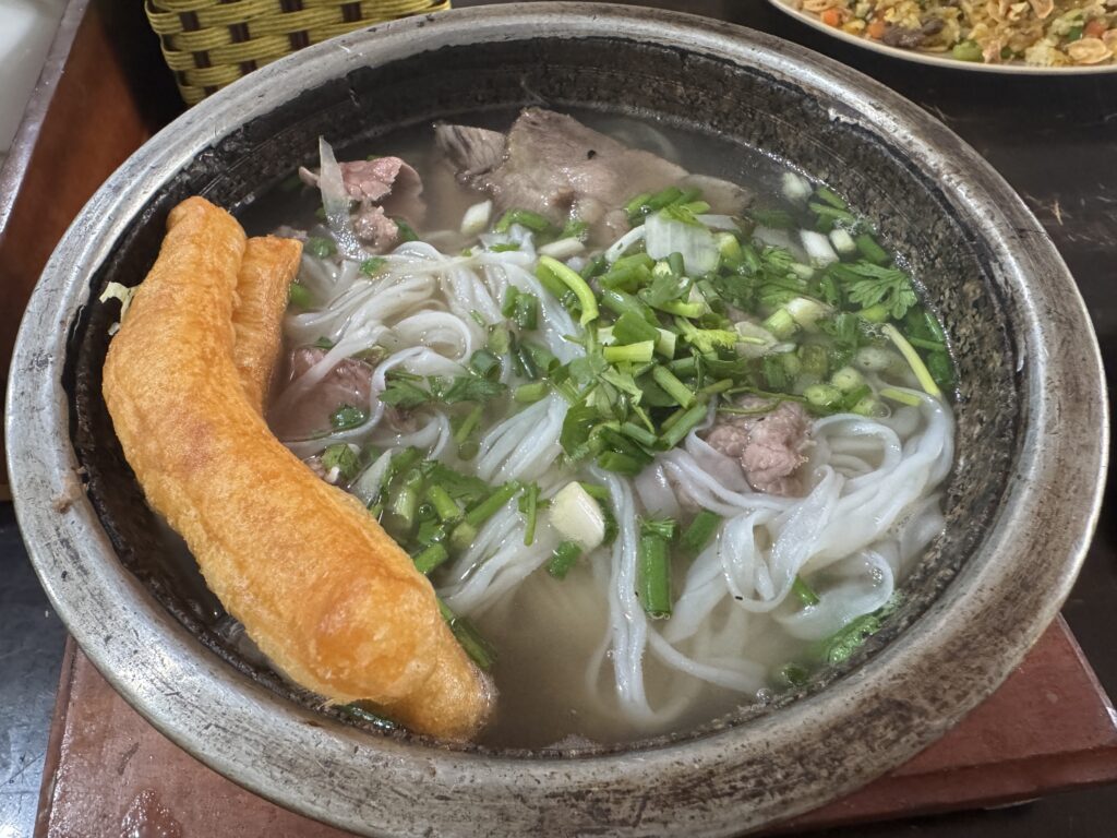 Close-up of hot stone bowl water buffalo pho in Hung Yen, Vietnam.