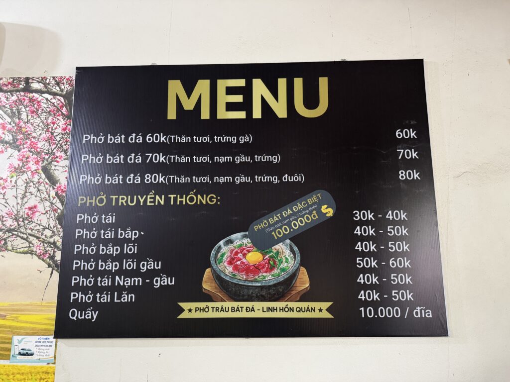 Menu of Pho Trau Bat Da featuring hot stone bowl water buffalo pho in Hung Yen, Vietnam.