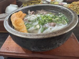 Hot stone bowl water buffalo pho served at Pho Trau Bat Da in Hung Yen, Vietnam.
