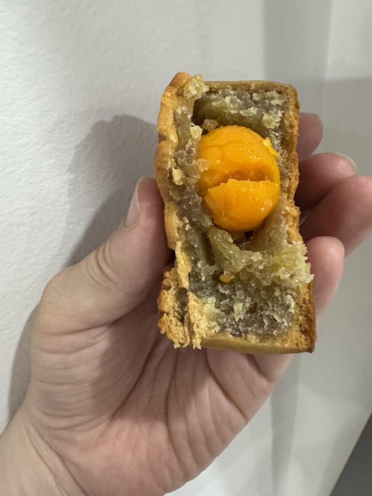 Cut mooncake with a golden egg yolk center from JW Marriott Hanoi