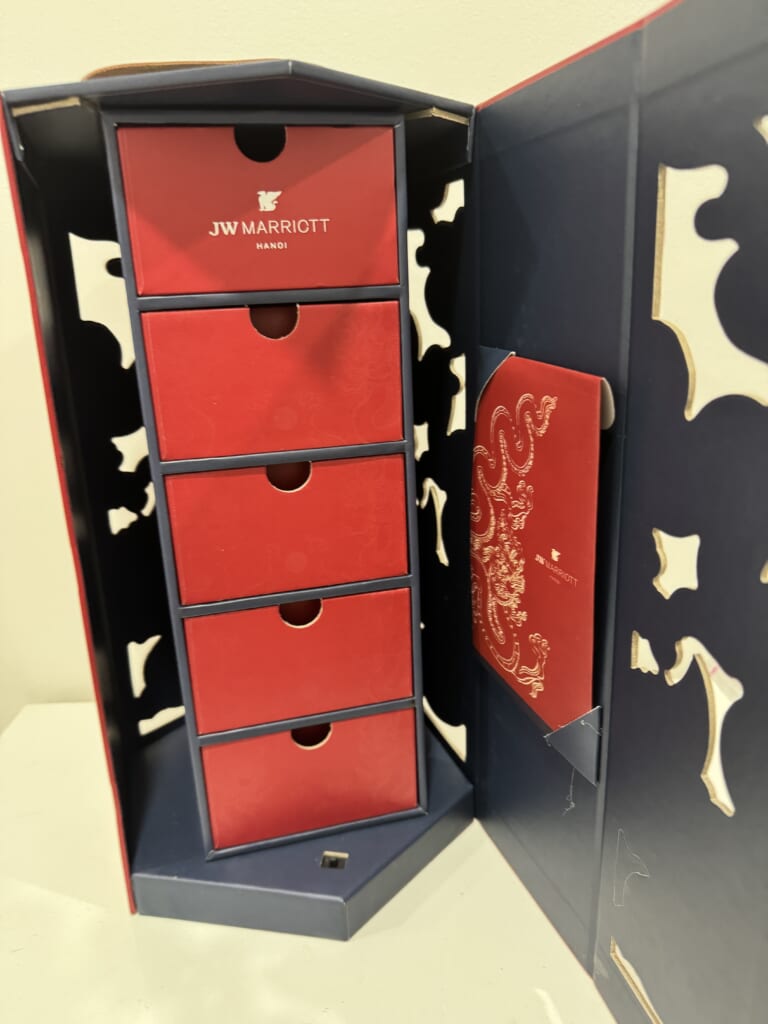 Opened JW Marriott Hanoi mooncake gift set with multiple red drawers